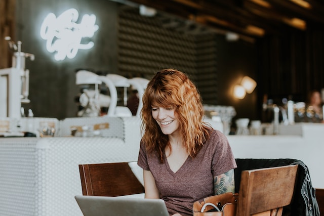 Woman reading IFPRO blog on laptop